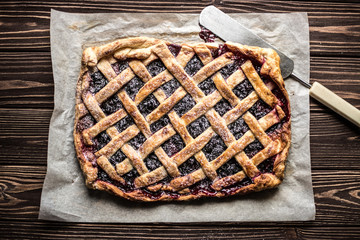 Homemade berry pie on a wooden background
