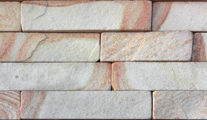 Wall of Indian sandstone with a beautiful structure, decorative building facing material