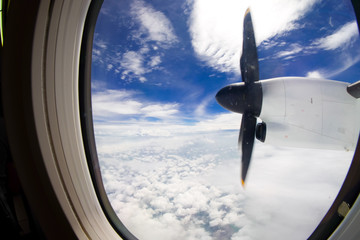 Naklejka na ściany i meble turboprop plane propeller seen through the window during flight