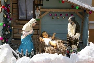 wooden christmas crib with colored balls