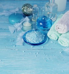 Obraz na płótnie Canvas Set for spa with towels, salt and aromatic oils, selective focus