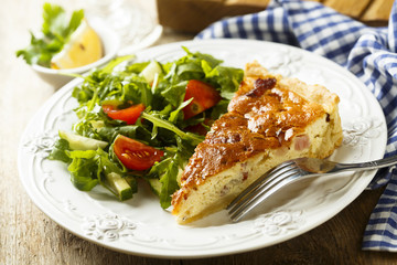 Savory pie with cream, bacon and eggs