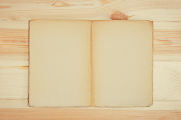 Vintage blank book or cookbook top view on wooden table background