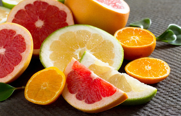 Naklejka na ściany i meble Citrus fruit collection of sliced grapefruits and tangerines on