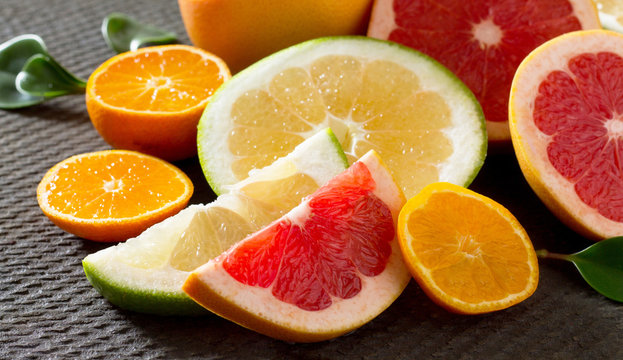 Citrus fruit collection of sliced grapefruits and tangerines on