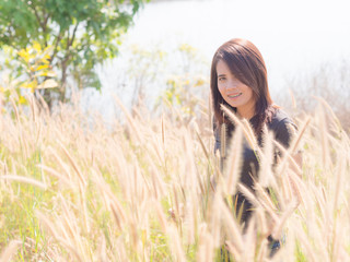 Asian beautiful Woman in the Meadow. On a sunny days.