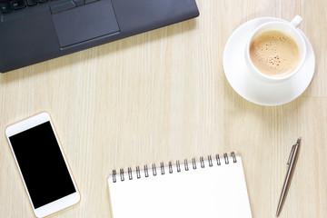 Top view of blank notepad, notebook, smart phone, pen and coffee