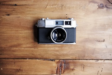 vintage film camera in wooden background