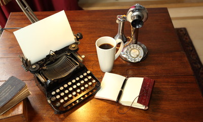 Antique typewriter telephone notebook pen book mug coffee