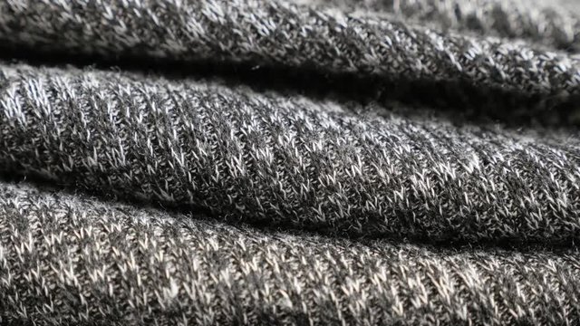 Gathers of modern bicolor knitwork slow tilt 4K 2160p 30fps UltraHD footage - Sweater for women knitting texture details shallow DOF 3840X2160 UHD tilting video