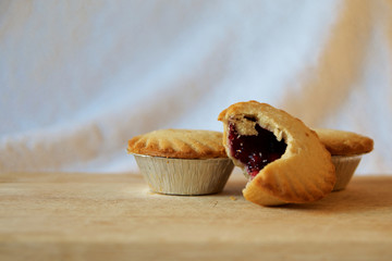 Two pies on a wooden board © Tristan