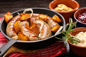Roast sausage with rosemary garlic and baked potatoes