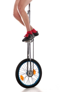 driving a unicycle on a white background
