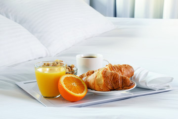 Breakfast in bed in hotel room.