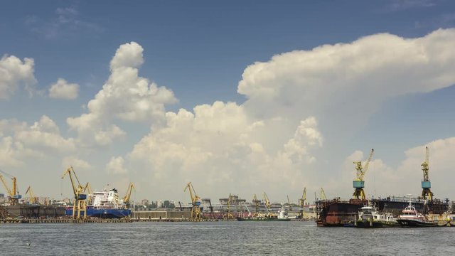 Time lapse with cumulus clouds and industrial seaport of Constanta, Romania.