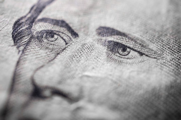 Alexander Hamilton eyes close up $10 dollar bill