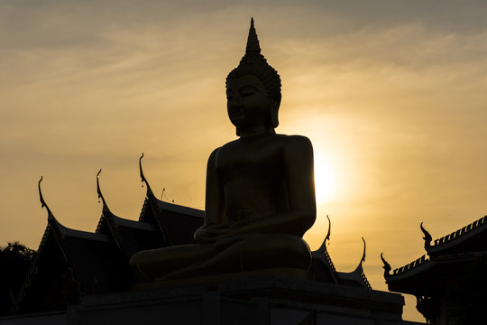 silhouette buddha statue at tample Thailand