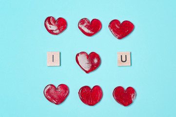 Lollipops with wooden letters. Red hearts. Candy. Love concept. Valentine day.