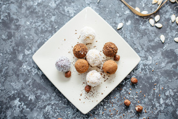 hand-made vegan truffles and candies with coconut and pumpkon