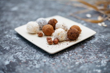 hand-made vegan truffles and candies with coconut and pumpkon
