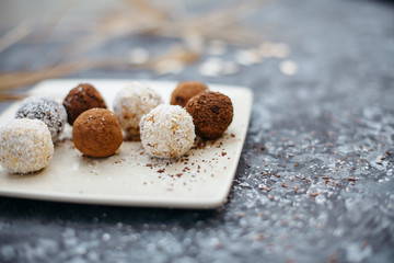 hand-made vegan truffles and candies with coconut and pumpkon