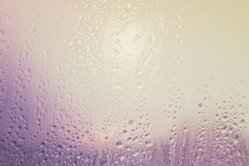 Water drops on a sweaty glass background soft toned