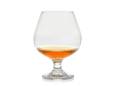 Cognac glass with brandy isolated on white background with reflection