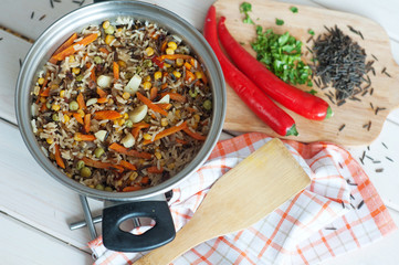 Rice with vegetables, vegetarian dish.