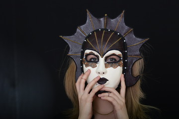 blonde with a theatrical mask