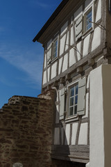 Residential tudor style house with blue sky in background