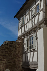 Fototapeta na wymiar Residential tudor style house with blue sky in background