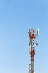 Telecommunication tower with a blue sky.