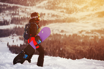 girl snowboarding in the mountains
