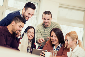 Shot of a friends having a great time in cafe