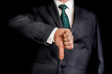 Businessman showing gesture with thumb down © andriano_cz