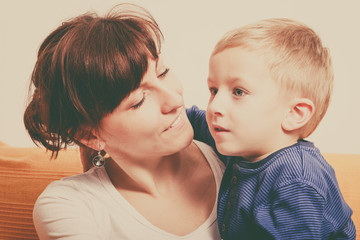 Mother hugging her son, little boy