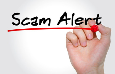 Hand writing inscription Scam Alert with marker, concept