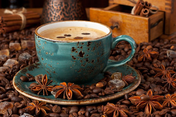 Composition with  coffee cup, coffee  beans and old mill
