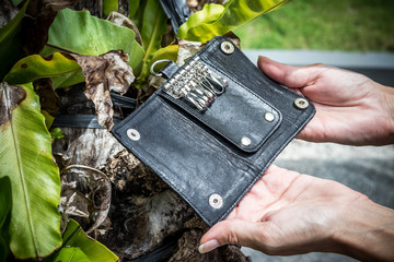Leather Keychain, handmade snakeskin python. Bali island. Green and wooden background.