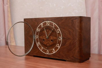 Vintage wooden clock with the lid open