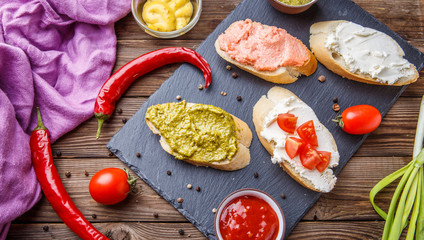 Fototapeta na wymiar Sandwiches with peppers in kitchen