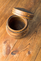 Blank wooden bowl on table background