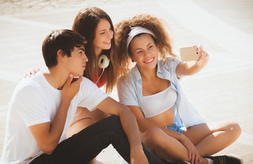 group of teenagers on the street doing selfie