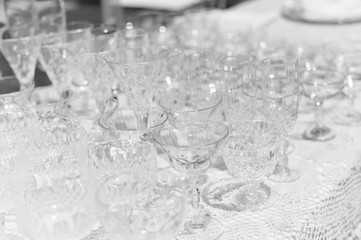 Special event and empty clear glasses setting on white table background, closeup image