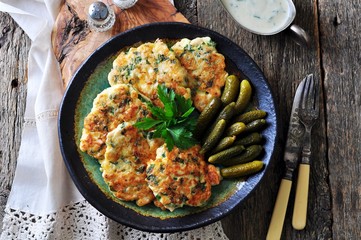 Chops chicken fillet with onion and parsley fried in olive oil.