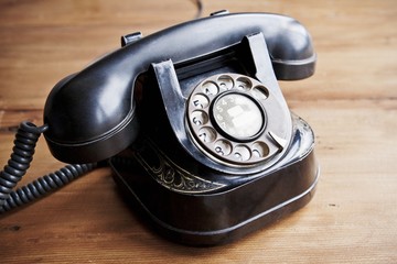 Vintage phone in wooden background