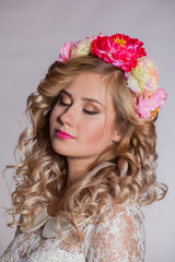 young and beautiful blonde with a wreath of flowers in her hair