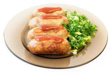 Homemade fried sausages with herbs isolated on white background.
