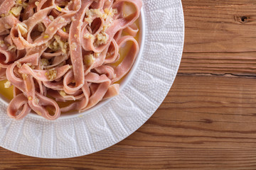 pink spaghetti cooked in a sauce