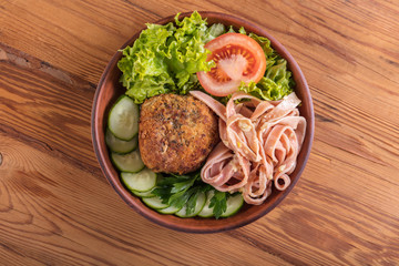 spaghetti and scotch egg with vegetables